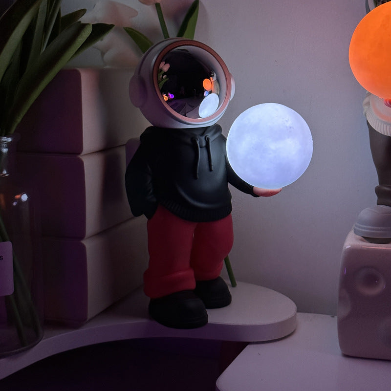 NNEDSZ Holding the romantic moon (black top + red pants) Creative Astronaut Bluetooth Speaker with 3D Starry Sky Lighting, Portable Wireless Moon Lamp Speaker - Perfect Gift for Space Enthusiasts
