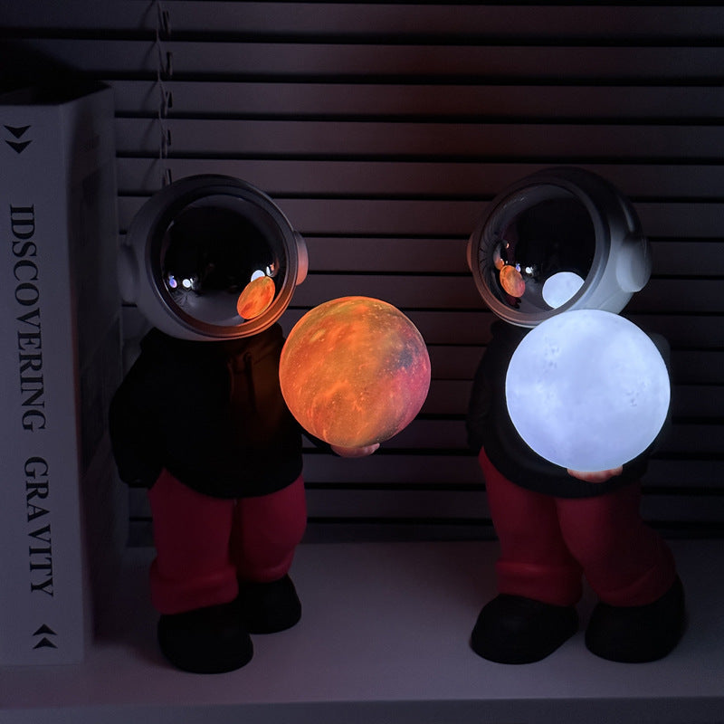NNEDSZ Holding the romantic moon (black top + red pants) Creative Astronaut Bluetooth Speaker with 3D Starry Sky Lighting, Portable Wireless Moon Lamp Speaker - Perfect Gift for Space Enthusiasts